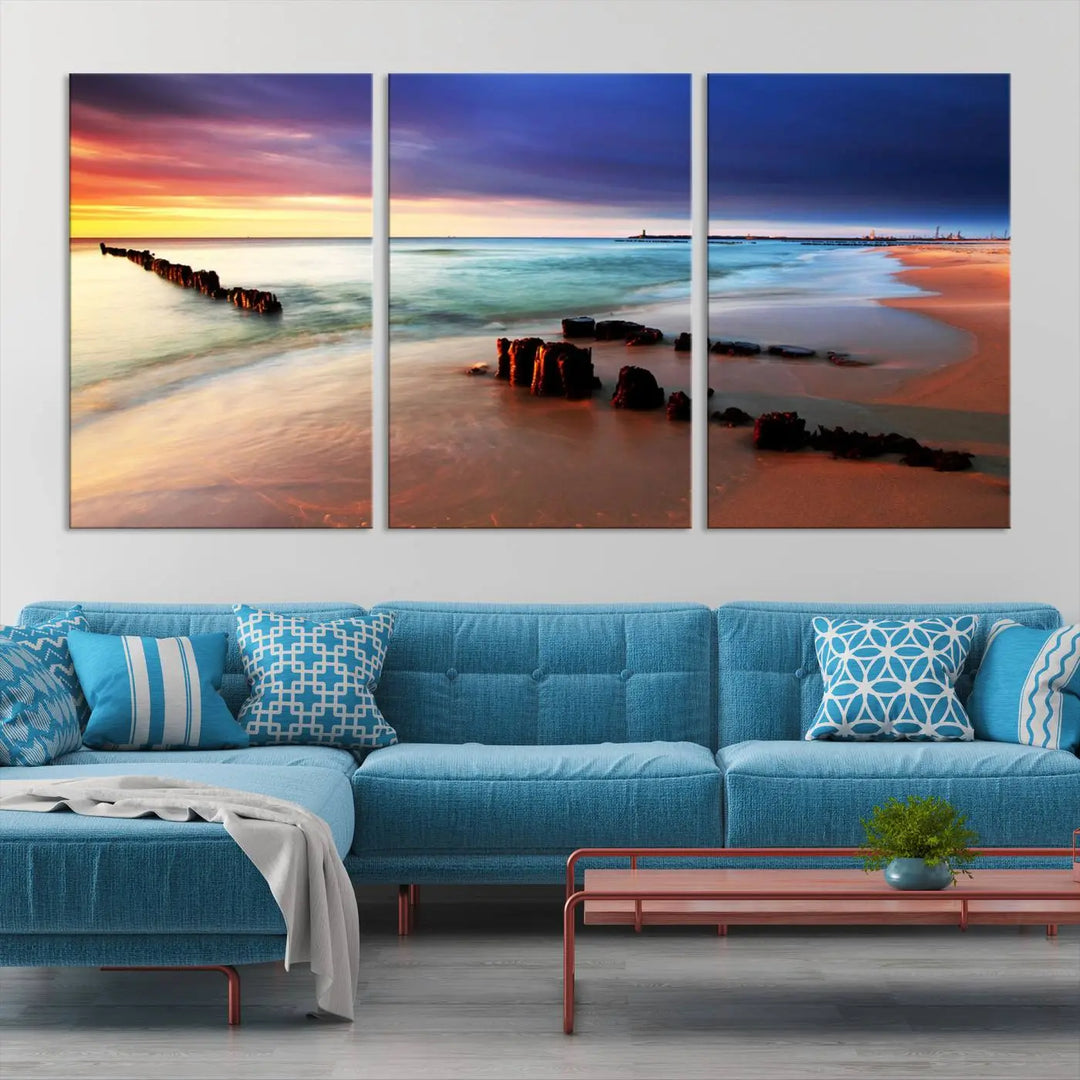 The gray wall in this living room is enhanced by a large beach triptych canvas wall art titled "Beach Sunset and Ocean Waves Canvas Wall Art, Set of 3, Seaside Serenity Coastal Decor," which captures the essence of a serene ocean scene.