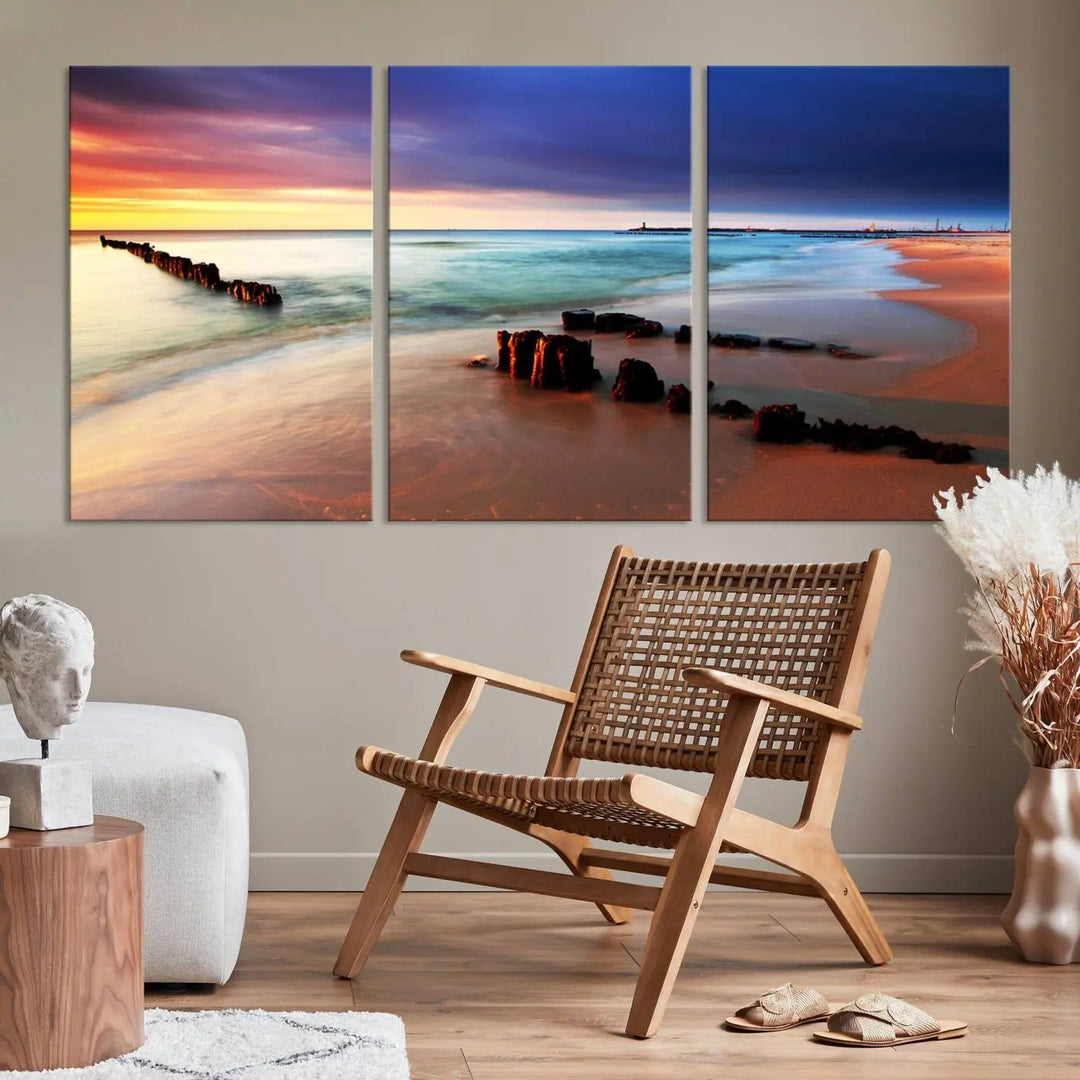 The gray wall in this living room is enhanced by a large beach triptych canvas wall art titled "Beach Sunset and Ocean Waves Canvas Wall Art, Set of 3, Seaside Serenity Coastal Decor," which captures the essence of a serene ocean scene.