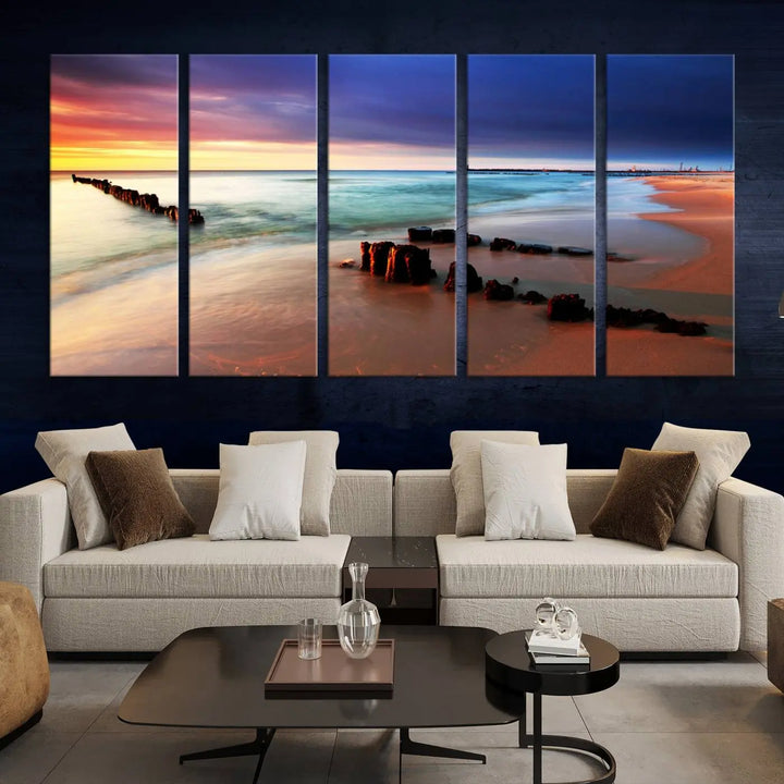 The gray wall in this living room is enhanced by a large beach triptych canvas wall art titled "Beach Sunset and Ocean Waves Canvas Wall Art, Set of 3, Seaside Serenity Coastal Decor," which captures the essence of a serene ocean scene.