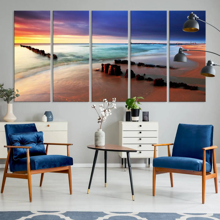 The gray wall in this living room is enhanced by a large beach triptych canvas wall art titled "Beach Sunset and Ocean Waves Canvas Wall Art, Set of 3, Seaside Serenity Coastal Decor," which captures the essence of a serene ocean scene.