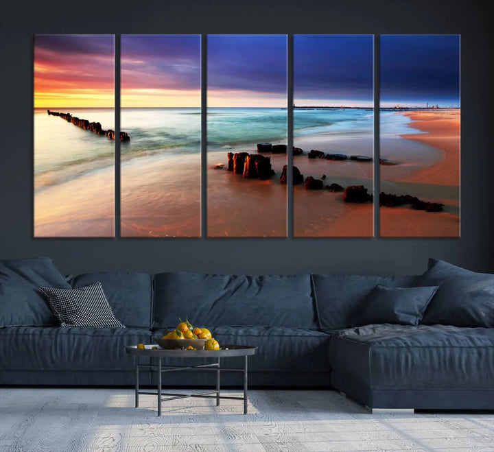 The gray wall in this living room is enhanced by a large beach triptych canvas wall art titled "Beach Sunset and Ocean Waves Canvas Wall Art, Set of 3, Seaside Serenity Coastal Decor," which captures the essence of a serene ocean scene.