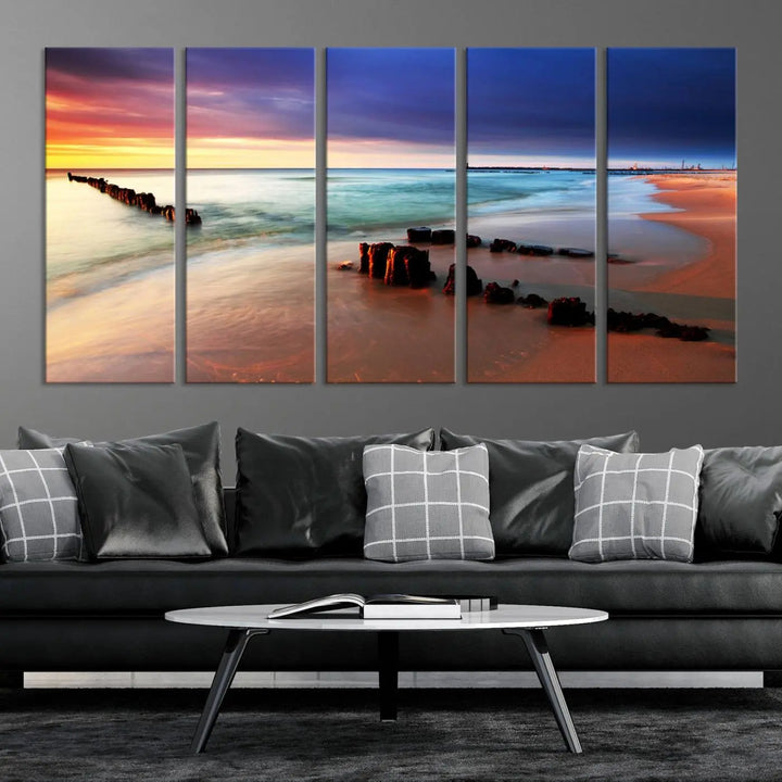 The gray wall in this living room is enhanced by a large beach triptych canvas wall art titled "Beach Sunset and Ocean Waves Canvas Wall Art, Set of 3, Seaside Serenity Coastal Decor," which captures the essence of a serene ocean scene.