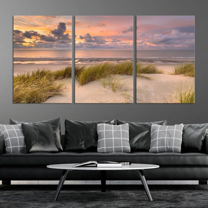 A triptych of serene sunset beach wall art graces the living room, with its museum-quality canvas accentuating the space. Each piece from the Beach Wall Art Canvas Print Sunset Artwork Print Coastal Wall Art collection comes ready to hang and features a UV-protective coating for lasting beauty.