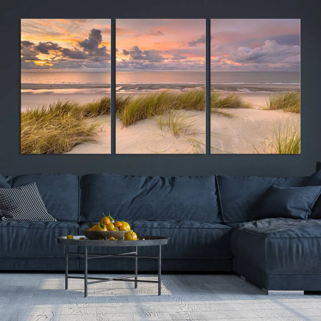 A triptych of serene sunset beach wall art graces the living room, with its museum-quality canvas accentuating the space. Each piece from the Beach Wall Art Canvas Print Sunset Artwork Print Coastal Wall Art collection comes ready to hang and features a UV-protective coating for lasting beauty.