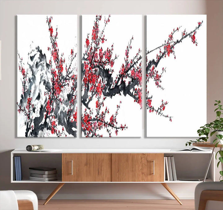 The "Beautiful Cherry Blossom Canvas Print Wall Art" showcases vibrant red cherry blossoms on a monochrome background, featuring museum-quality canvases and a gallery-wrapped finish.