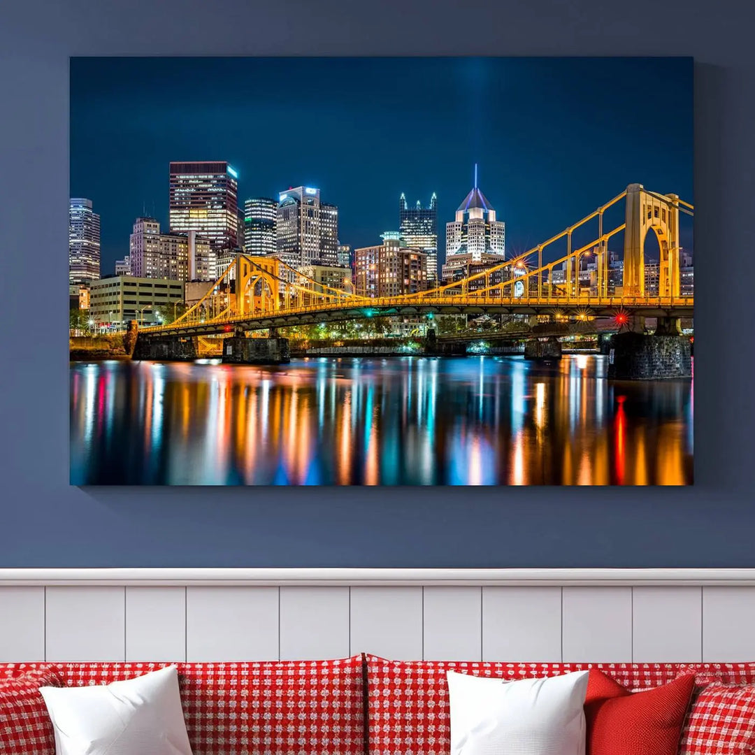 A cityscape at night showcases the illuminated beauty of Pittsburgh, with its bridge and skyscrapers casting glowing reflections on the river, all beautifully captured on this museum-quality canvas titled "Beautiful Pittsburgh Skyline Wall Art.