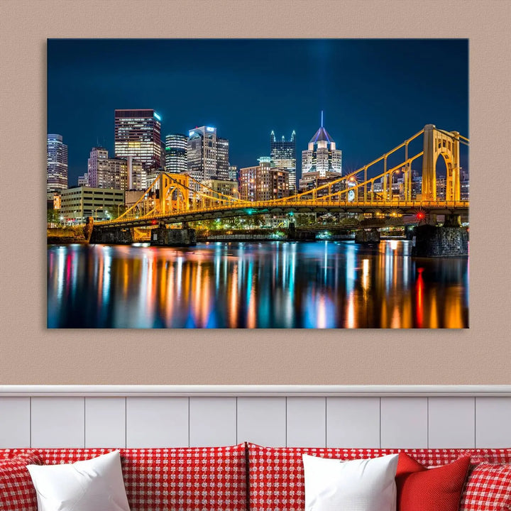 A cityscape at night showcases the illuminated beauty of Pittsburgh, with its bridge and skyscrapers casting glowing reflections on the river, all beautifully captured on this museum-quality canvas titled "Beautiful Pittsburgh Skyline Wall Art.