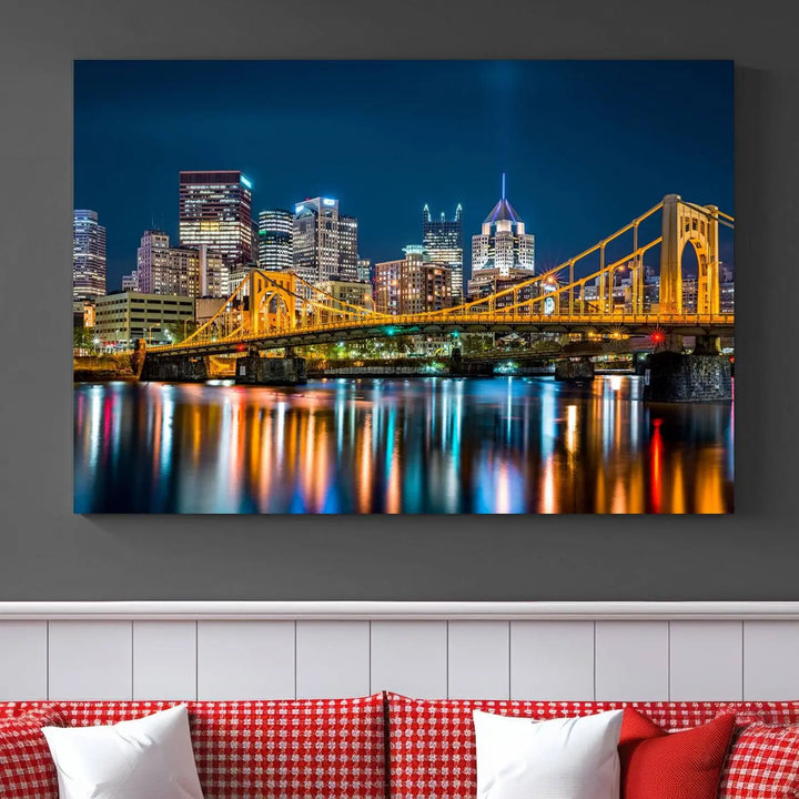 A cityscape at night showcases the illuminated beauty of Pittsburgh, with its bridge and skyscrapers casting glowing reflections on the river, all beautifully captured on this museum-quality canvas titled "Beautiful Pittsburgh Skyline Wall Art.