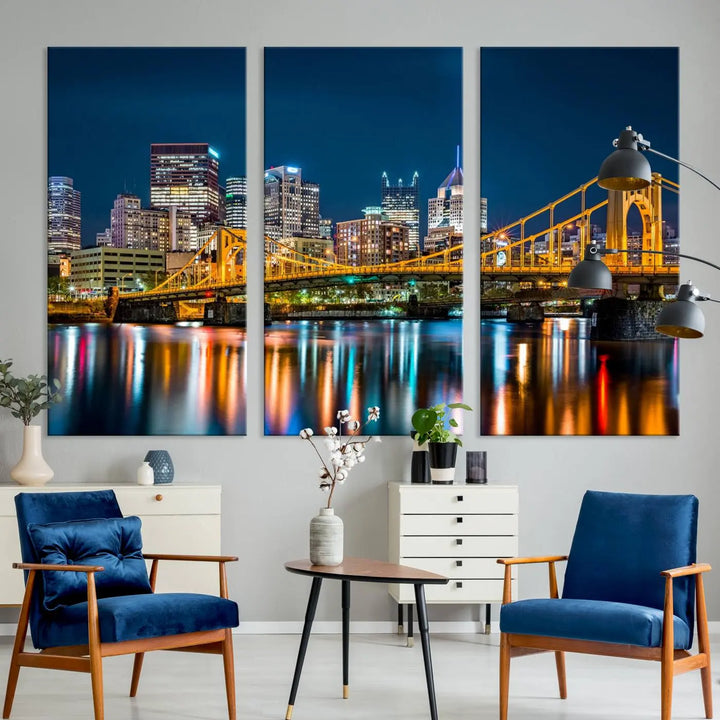 A cityscape at night showcases the illuminated beauty of Pittsburgh, with its bridge and skyscrapers casting glowing reflections on the river, all beautifully captured on this museum-quality canvas titled "Beautiful Pittsburgh Skyline Wall Art.