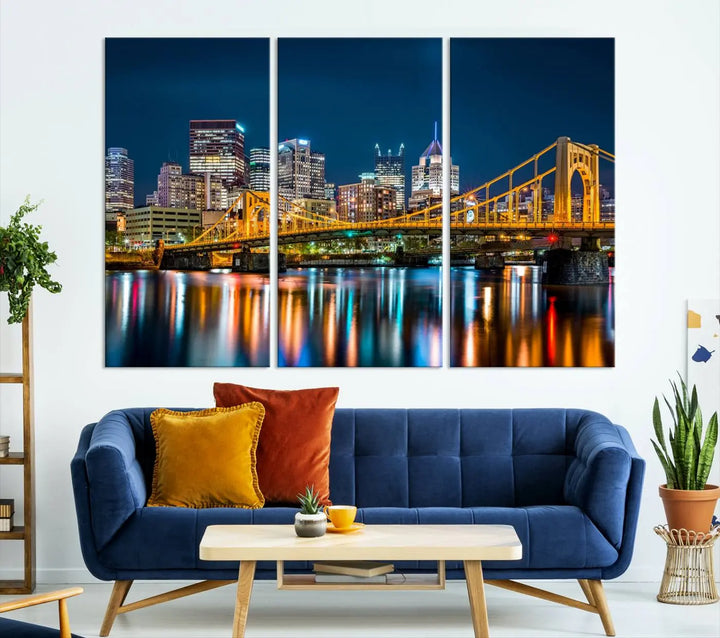 A cityscape at night showcases the illuminated beauty of Pittsburgh, with its bridge and skyscrapers casting glowing reflections on the river, all beautifully captured on this museum-quality canvas titled "Beautiful Pittsburgh Skyline Wall Art.