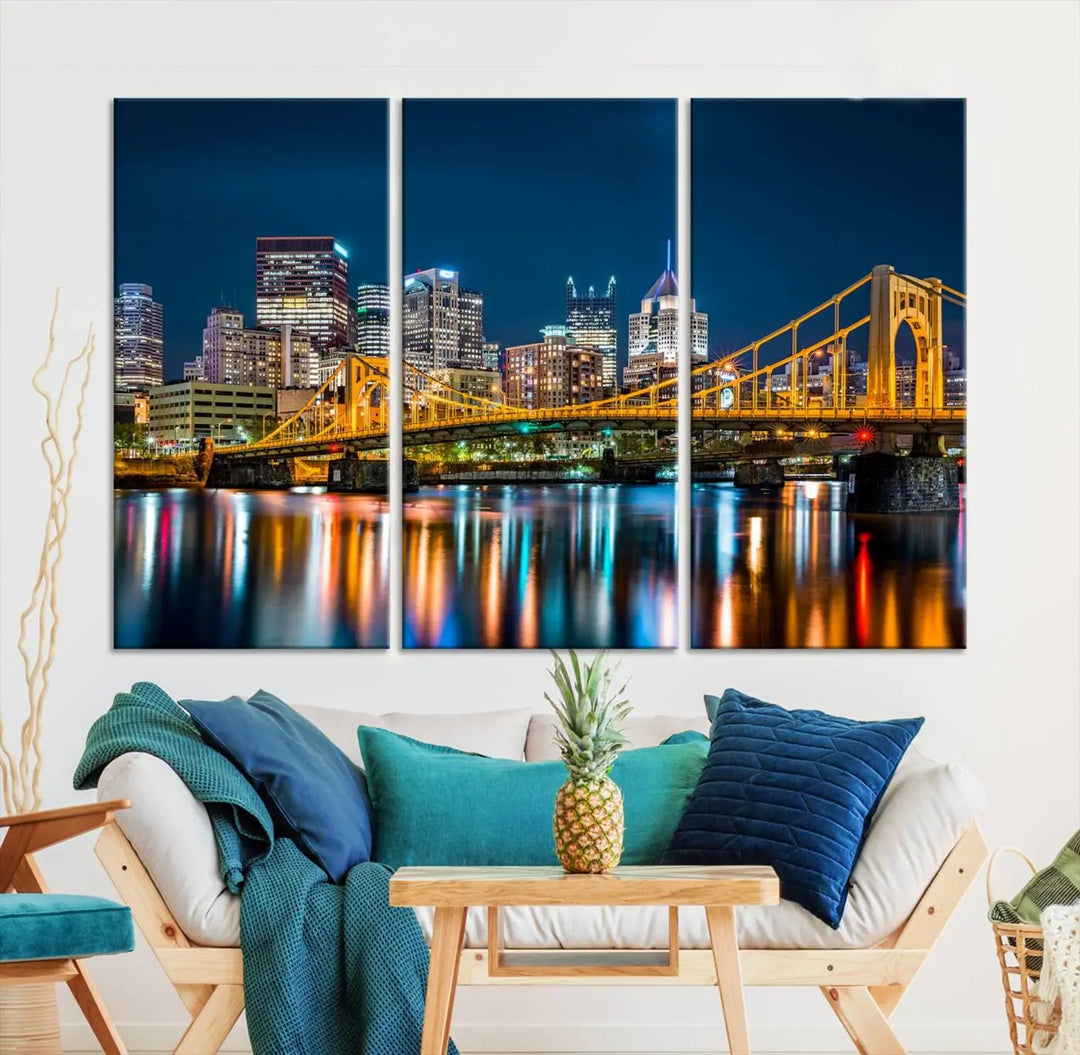 A cityscape at night showcases the illuminated beauty of Pittsburgh, with its bridge and skyscrapers casting glowing reflections on the river, all beautifully captured on this museum-quality canvas titled "Beautiful Pittsburgh Skyline Wall Art.