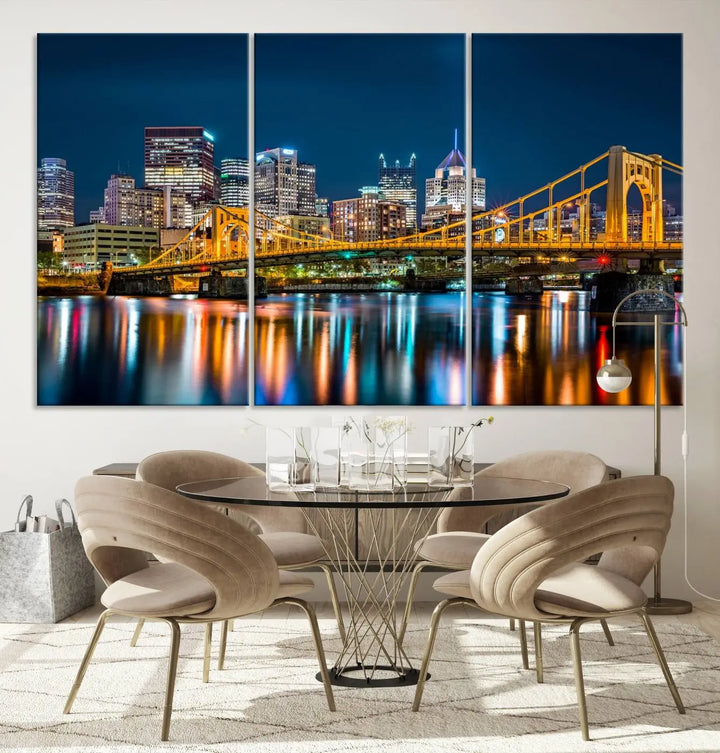 A cityscape at night showcases the illuminated beauty of Pittsburgh, with its bridge and skyscrapers casting glowing reflections on the river, all beautifully captured on this museum-quality canvas titled "Beautiful Pittsburgh Skyline Wall Art.