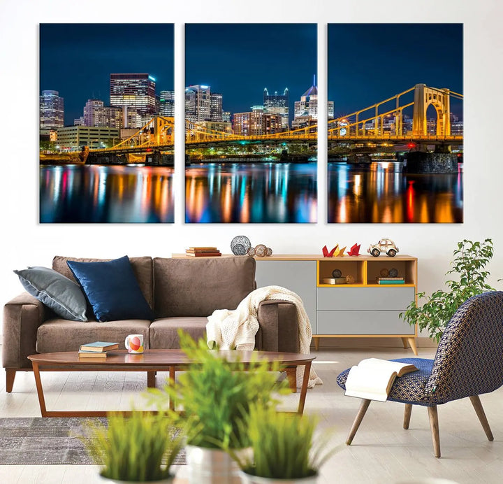 A cityscape at night showcases the illuminated beauty of Pittsburgh, with its bridge and skyscrapers casting glowing reflections on the river, all beautifully captured on this museum-quality canvas titled "Beautiful Pittsburgh Skyline Wall Art.