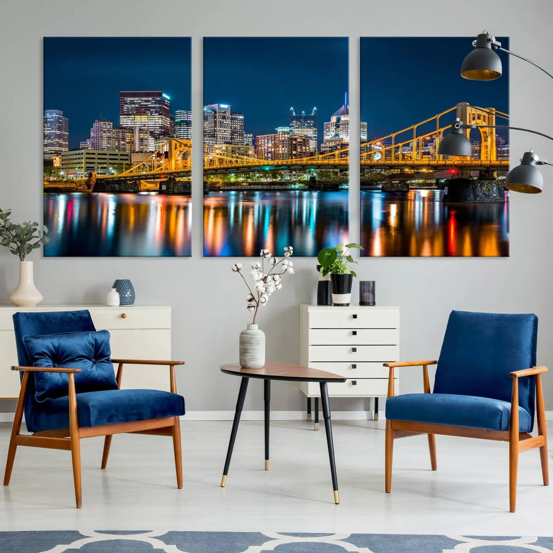 A cityscape at night showcases the illuminated beauty of Pittsburgh, with its bridge and skyscrapers casting glowing reflections on the river, all beautifully captured on this museum-quality canvas titled "Beautiful Pittsburgh Skyline Wall Art.