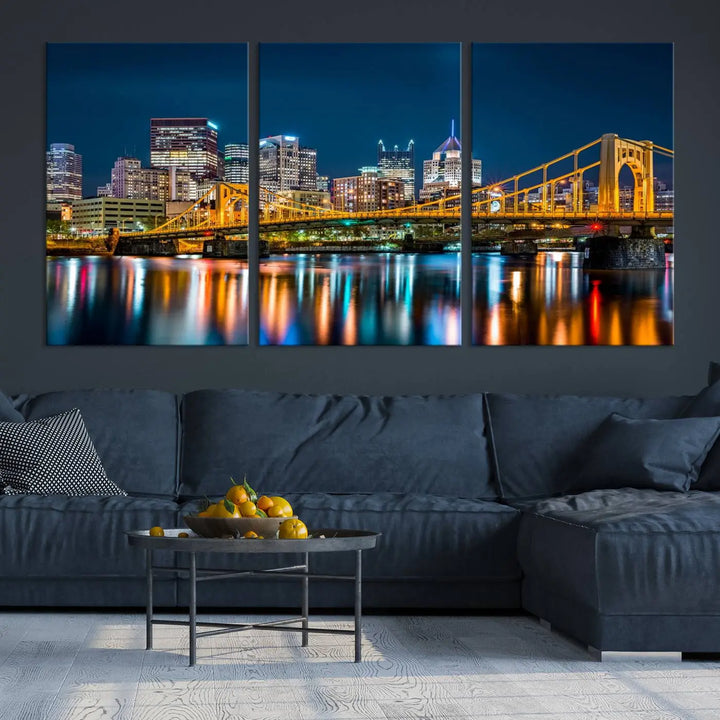 A cityscape at night showcases the illuminated beauty of Pittsburgh, with its bridge and skyscrapers casting glowing reflections on the river, all beautifully captured on this museum-quality canvas titled "Beautiful Pittsburgh Skyline Wall Art.