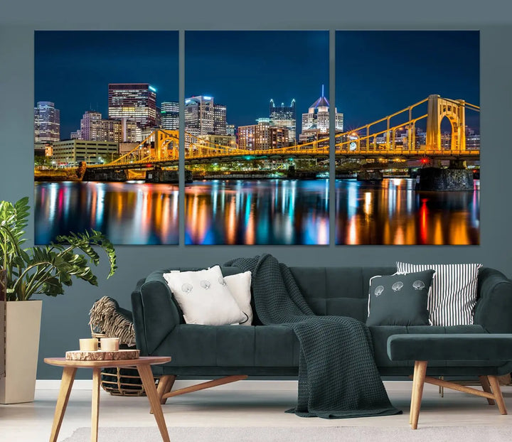 A cityscape at night showcases the illuminated beauty of Pittsburgh, with its bridge and skyscrapers casting glowing reflections on the river, all beautifully captured on this museum-quality canvas titled "Beautiful Pittsburgh Skyline Wall Art.