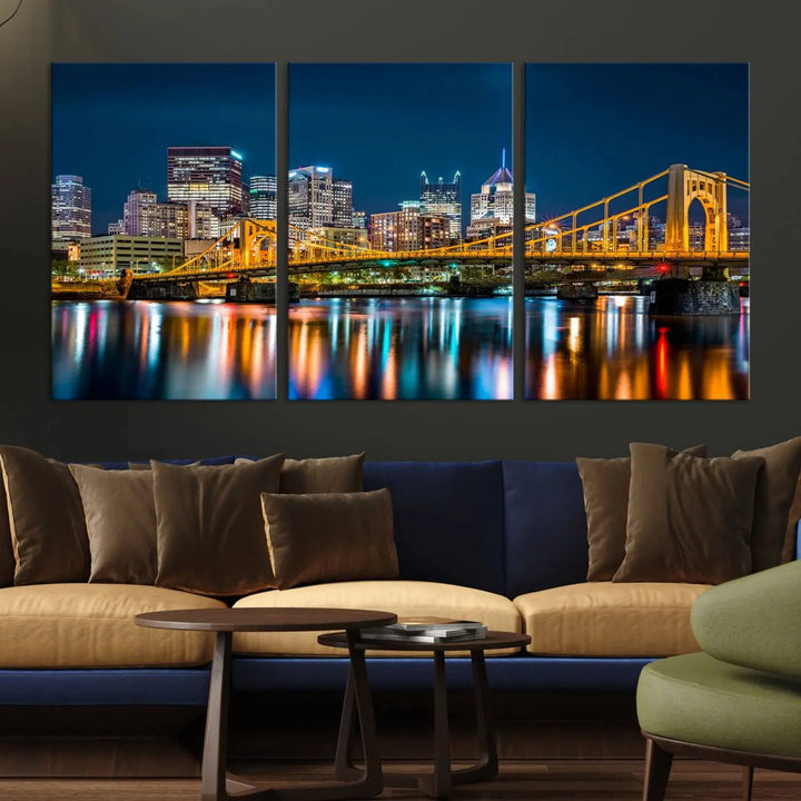 A cityscape at night showcases the illuminated beauty of Pittsburgh, with its bridge and skyscrapers casting glowing reflections on the river, all beautifully captured on this museum-quality canvas titled "Beautiful Pittsburgh Skyline Wall Art.