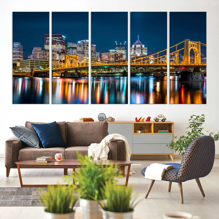 A cityscape at night showcases the illuminated beauty of Pittsburgh, with its bridge and skyscrapers casting glowing reflections on the river, all beautifully captured on this museum-quality canvas titled "Beautiful Pittsburgh Skyline Wall Art.