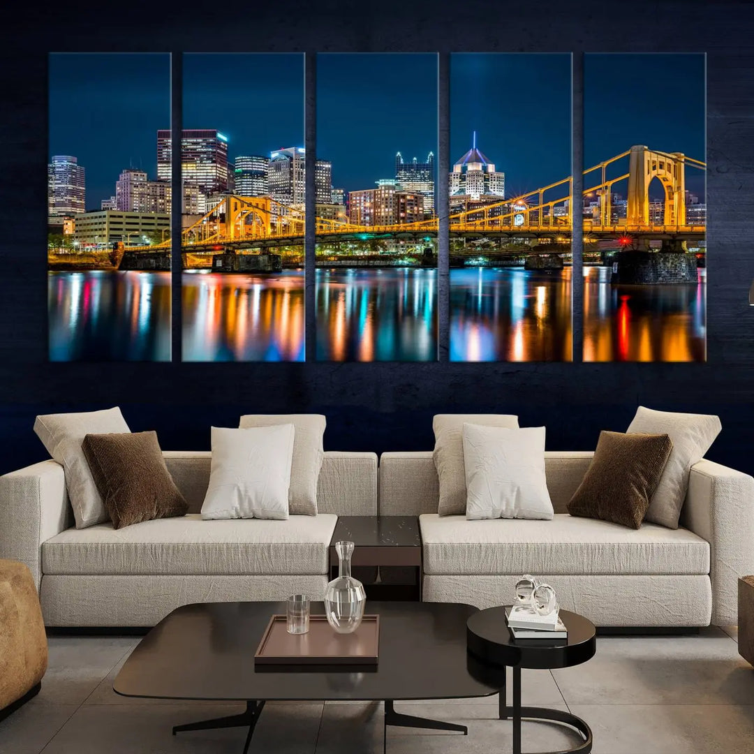 A cityscape at night showcases the illuminated beauty of Pittsburgh, with its bridge and skyscrapers casting glowing reflections on the river, all beautifully captured on this museum-quality canvas titled "Beautiful Pittsburgh Skyline Wall Art.