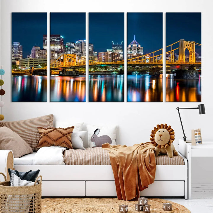 A cityscape at night showcases the illuminated beauty of Pittsburgh, with its bridge and skyscrapers casting glowing reflections on the river, all beautifully captured on this museum-quality canvas titled "Beautiful Pittsburgh Skyline Wall Art.