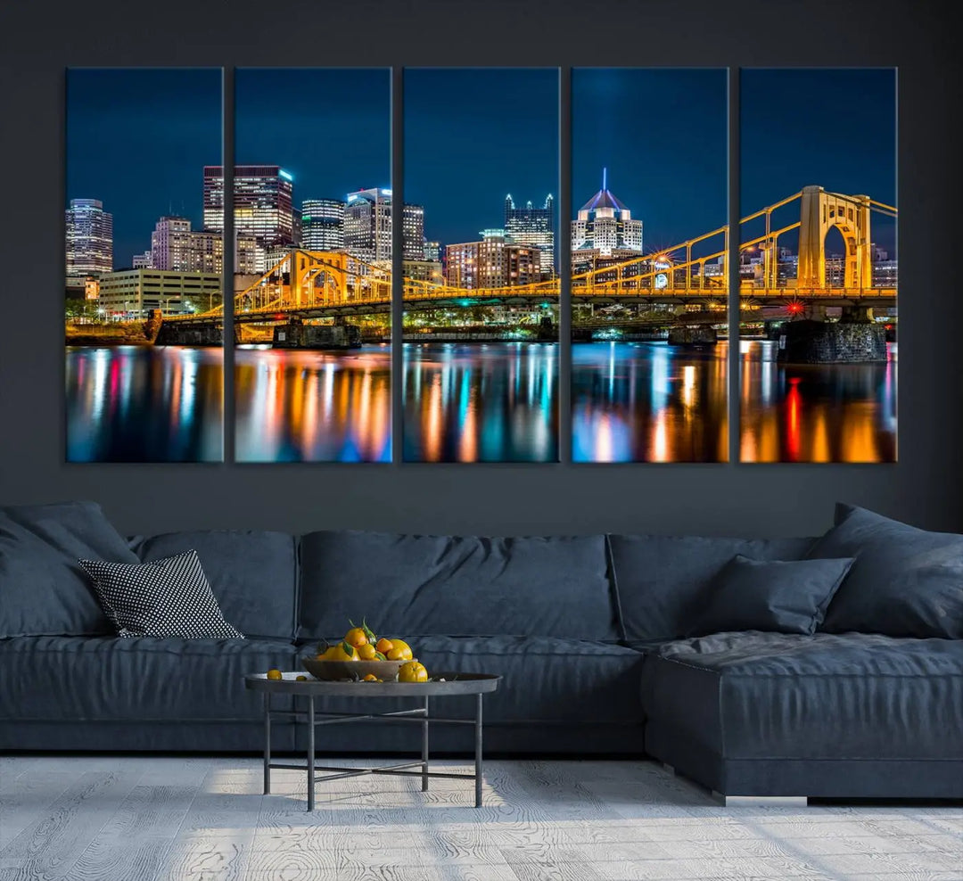 A cityscape at night showcases the illuminated beauty of Pittsburgh, with its bridge and skyscrapers casting glowing reflections on the river, all beautifully captured on this museum-quality canvas titled "Beautiful Pittsburgh Skyline Wall Art.