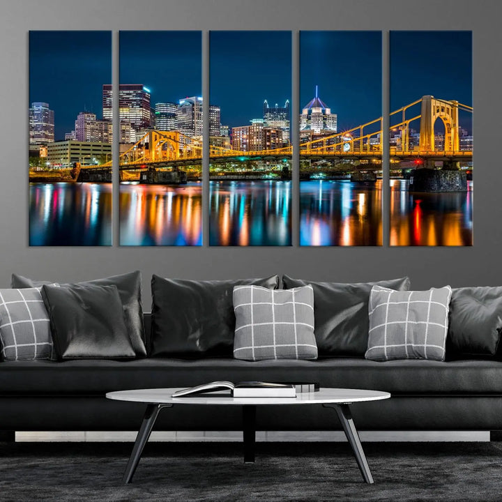 A cityscape at night showcases the illuminated beauty of Pittsburgh, with its bridge and skyscrapers casting glowing reflections on the river, all beautifully captured on this museum-quality canvas titled "Beautiful Pittsburgh Skyline Wall Art.