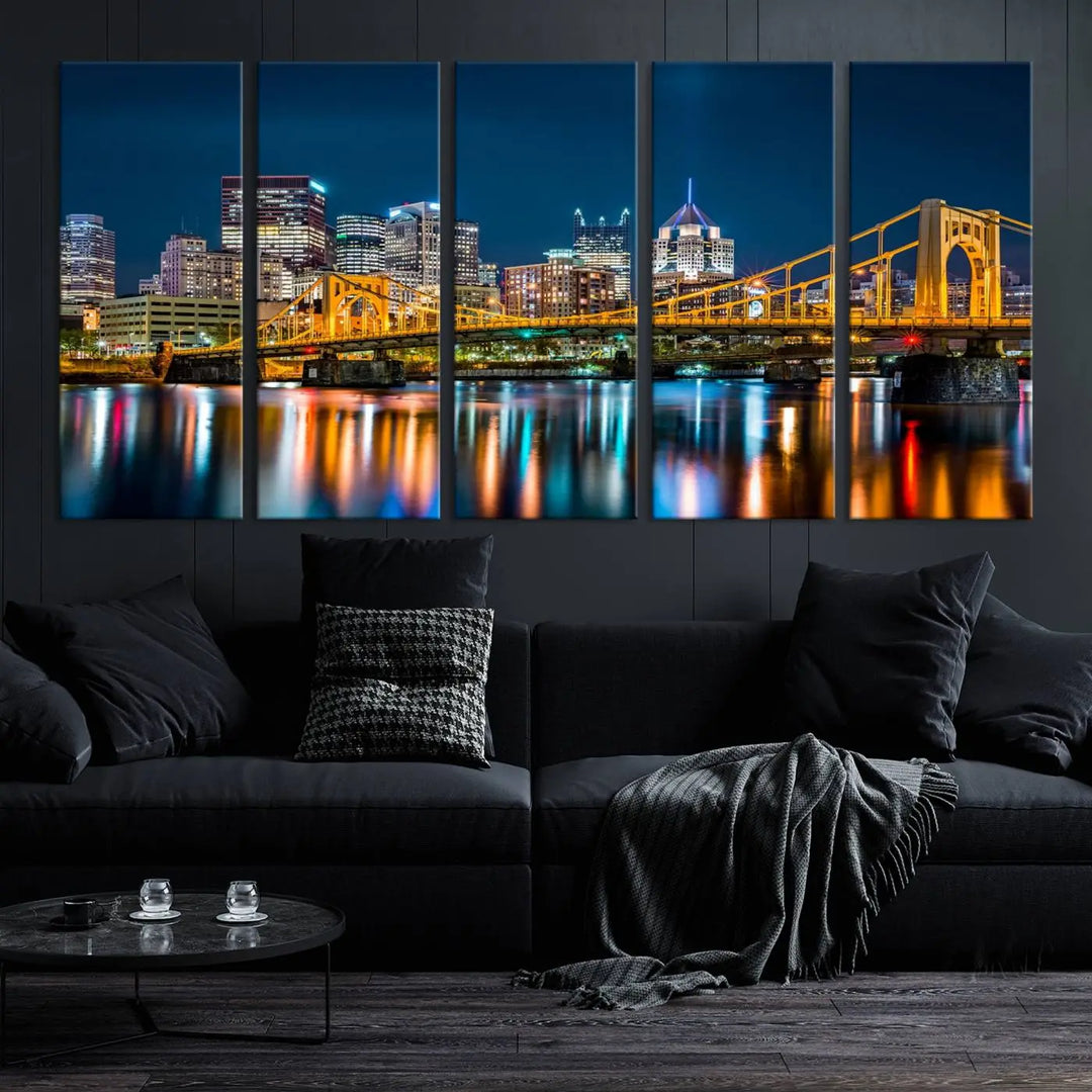 A cityscape at night showcases the illuminated beauty of Pittsburgh, with its bridge and skyscrapers casting glowing reflections on the river, all beautifully captured on this museum-quality canvas titled "Beautiful Pittsburgh Skyline Wall Art.