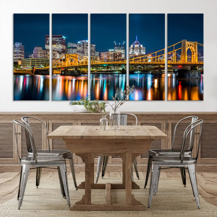 A cityscape at night showcases the illuminated beauty of Pittsburgh, with its bridge and skyscrapers casting glowing reflections on the river, all beautifully captured on this museum-quality canvas titled "Beautiful Pittsburgh Skyline Wall Art.