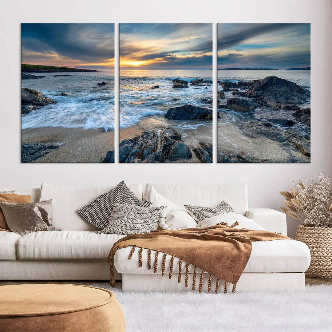 The "Beautiful Stormy Sunset at Bagh Steinigidh Beach Stones" triptych ocean-themed wall art is displayed on museum-quality canvas and features a UV-protective coating.