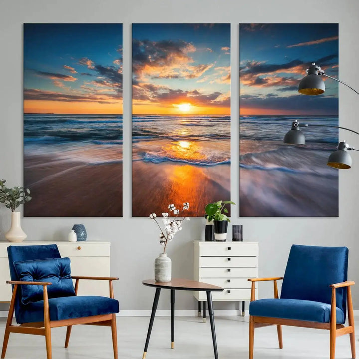 The living room showcases a triptych of the "Beautiful Sunset over the Horizon Beach" canvas wall art, crafted on museum-quality canvas with hand-assembled framing.