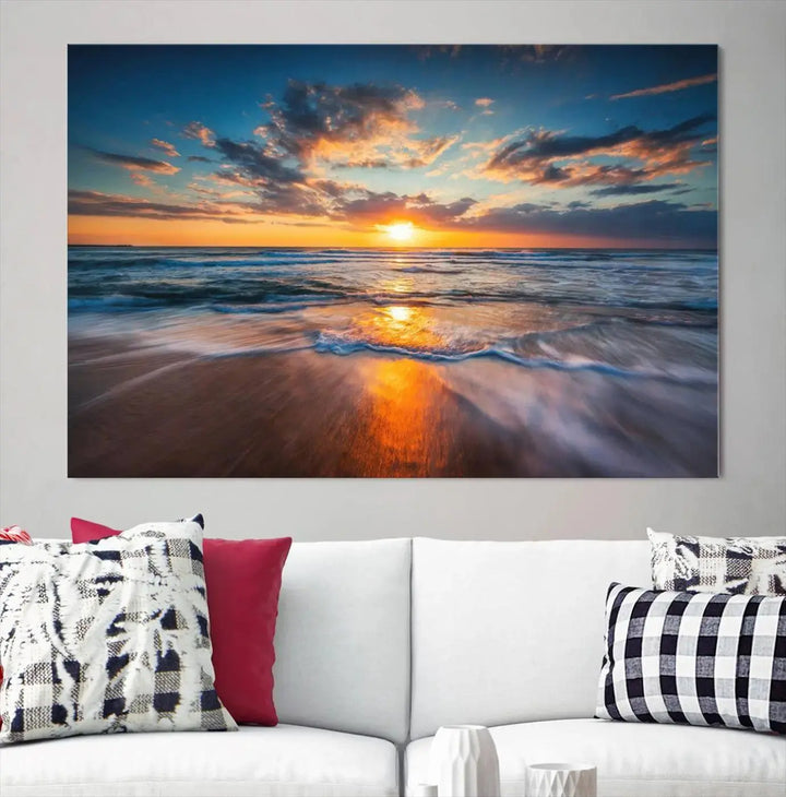 The living room showcases a triptych of the "Beautiful Sunset over the Horizon Beach" canvas wall art, crafted on museum-quality canvas with hand-assembled framing.