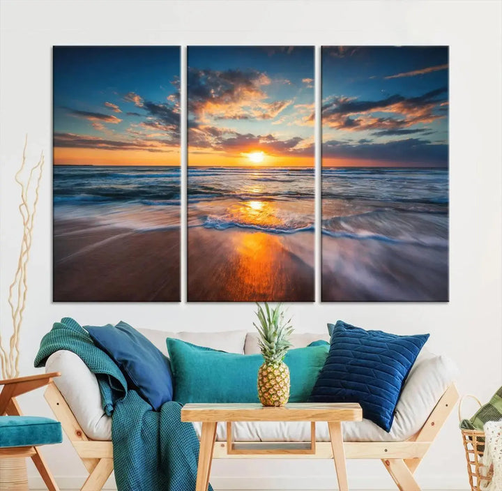 The living room showcases a triptych of the "Beautiful Sunset over the Horizon Beach" canvas wall art, crafted on museum-quality canvas with hand-assembled framing.