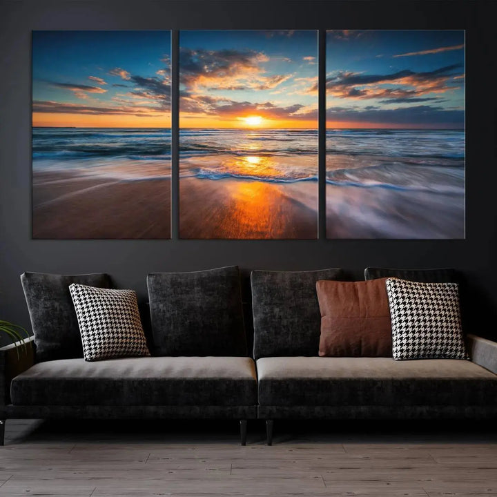 The living room showcases a triptych of the "Beautiful Sunset over the Horizon Beach" canvas wall art, crafted on museum-quality canvas with hand-assembled framing.