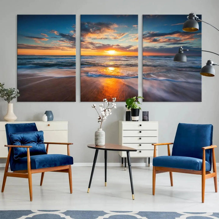 The living room showcases a triptych of the "Beautiful Sunset over the Horizon Beach" canvas wall art, crafted on museum-quality canvas with hand-assembled framing.