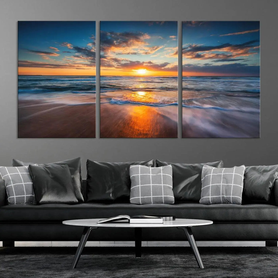 The living room showcases a triptych of the "Beautiful Sunset over the Horizon Beach" canvas wall art, crafted on museum-quality canvas with hand-assembled framing.