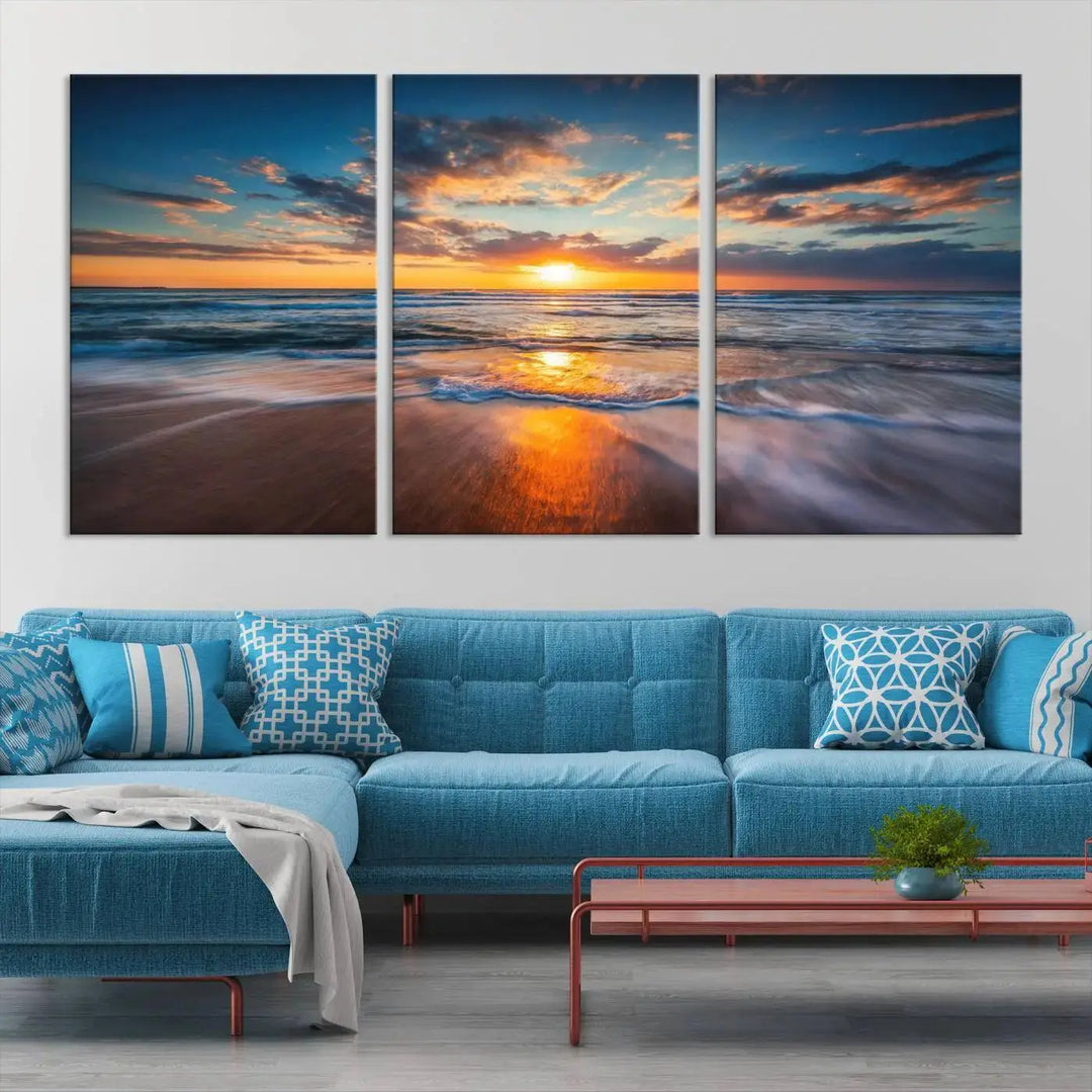 The living room showcases a triptych of the "Beautiful Sunset over the Horizon Beach" canvas wall art, crafted on museum-quality canvas with hand-assembled framing.