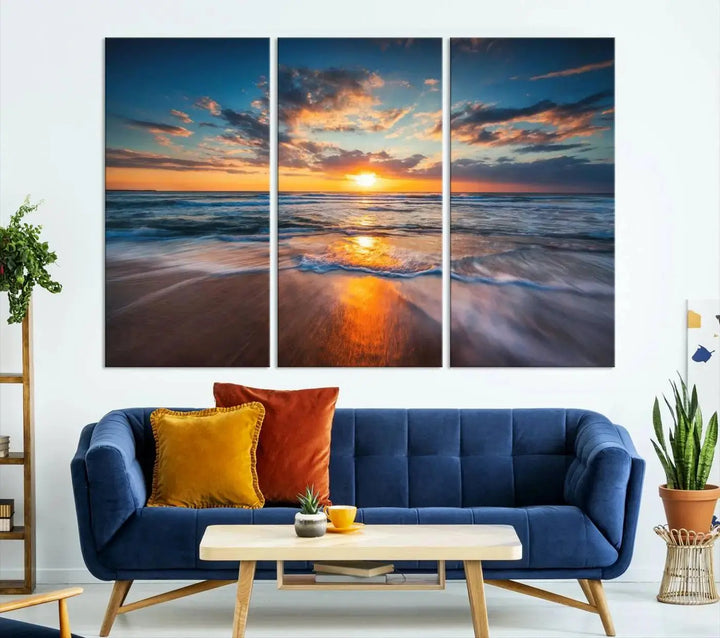 The living room showcases a triptych of the "Beautiful Sunset over the Horizon Beach" canvas wall art, crafted on museum-quality canvas with hand-assembled framing.