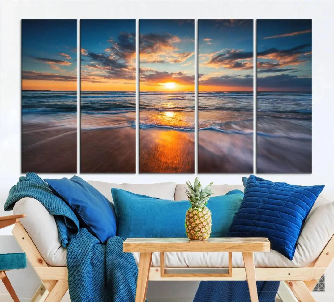 The living room showcases a triptych of the "Beautiful Sunset over the Horizon Beach" canvas wall art, crafted on museum-quality canvas with hand-assembled framing.