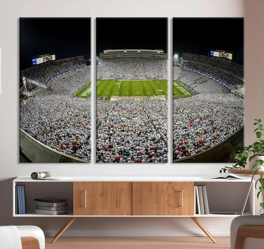 The Beaver Stadium Night Game Triple Canvas Wall Art - Penn State Nittany Lions Football Match features a panoramic view of a packed Beaver Stadium at night.