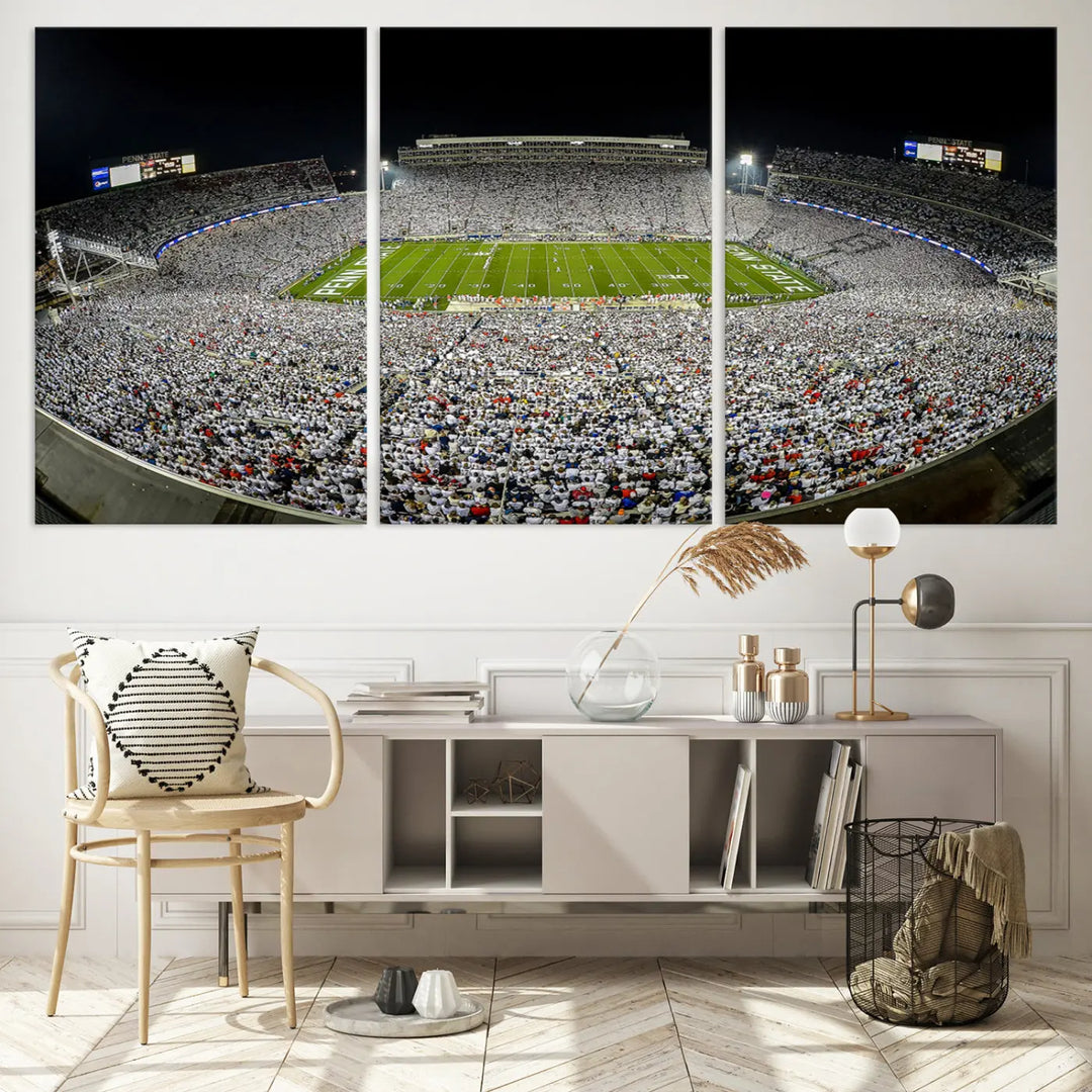 The Beaver Stadium Night Game Triple Canvas Wall Art - Penn State Nittany Lions Football Match features a panoramic view of a packed Beaver Stadium at night.