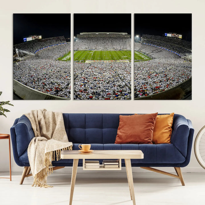 The Beaver Stadium Night Game Triple Canvas Wall Art - Penn State Nittany Lions Football Match features a panoramic view of a packed Beaver Stadium at night.