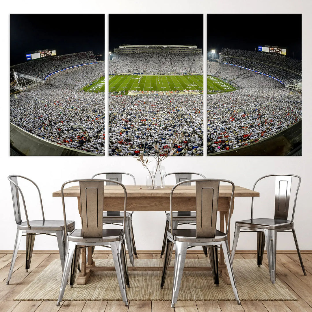 The Beaver Stadium Night Game Triple Canvas Wall Art - Penn State Nittany Lions Football Match features a panoramic view of a packed Beaver Stadium at night.