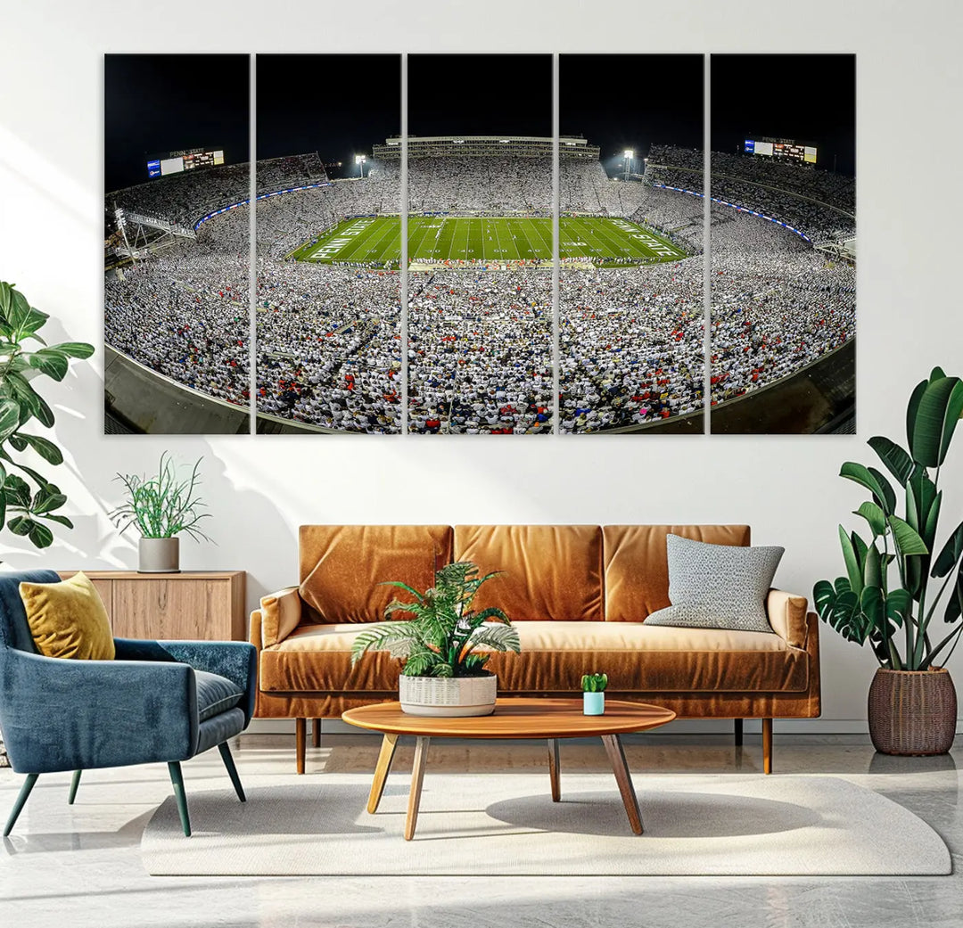 The Beaver Stadium Night Game Triple Canvas Wall Art - Penn State Nittany Lions Football Match features a panoramic view of a packed Beaver Stadium at night.