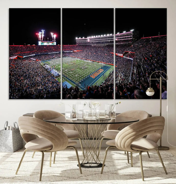 The Ben Hill Griffin Stadium Night Game Triple Canvas Wall Art - Florida Gators Football Match beautifully embodies the essence of a night game at the stadium, featuring fans, fireworks, and a marching band. This artwork is an ideal addition to a modern living room for any Florida Gators fan.