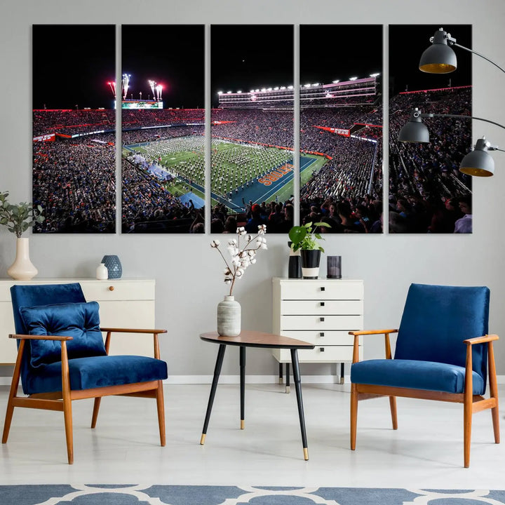 The Ben Hill Griffin Stadium Night Game Triple Canvas Wall Art - Florida Gators Football Match beautifully embodies the essence of a night game at the stadium, featuring fans, fireworks, and a marching band. This artwork is an ideal addition to a modern living room for any Florida Gators fan.