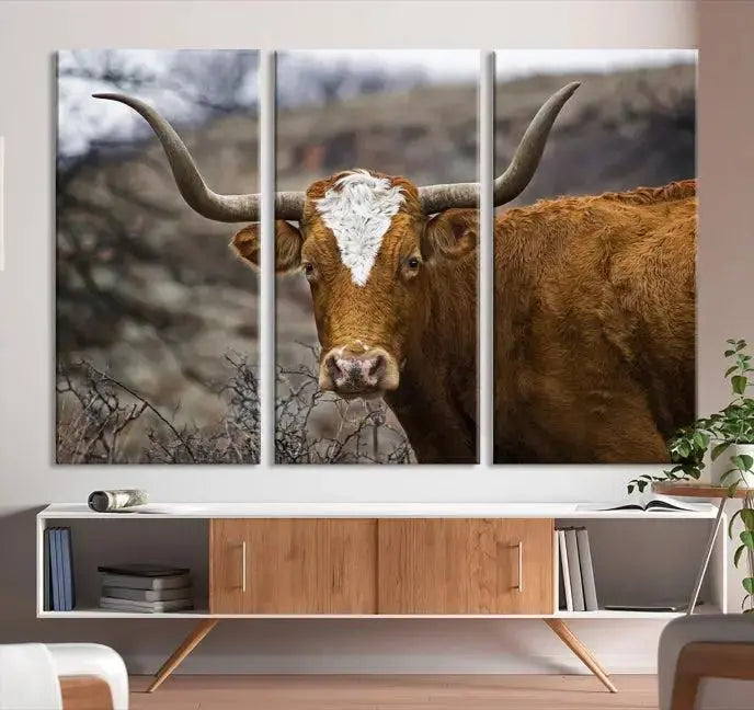 A set of three-panel wall art titled "Big Cow Animal Wall Art Canvas Print" showcases a brown longhorn cow in a natural setting. Each piece is expertly hand-assembled and crafted on museum-quality polycotton canvas, featuring a UV-protective coating to maintain its vivid allure.