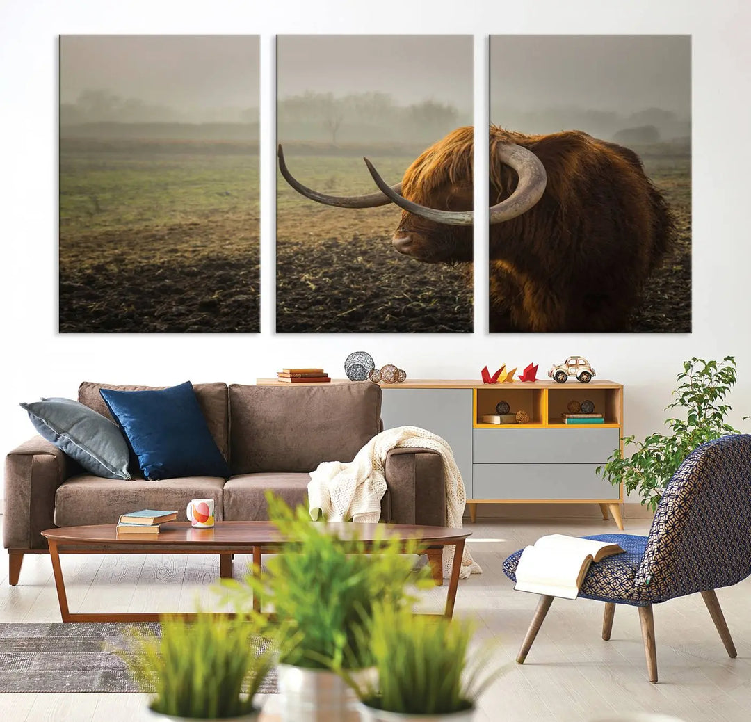 The "Big Cow Horn Wall Art Canvas Print" is a hand-assembled framed canvas depicting a Highland cow in a misty field. It is crafted with a UV-protective coating to ensure lasting vibrancy.