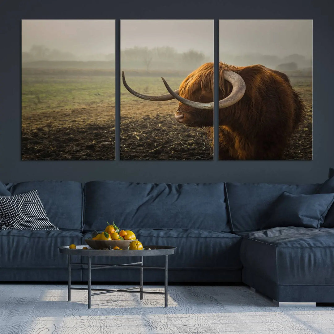 The "Big Cow Horn Wall Art Canvas Print" is a hand-assembled framed canvas depicting a Highland cow in a misty field. It is crafted with a UV-protective coating to ensure lasting vibrancy.