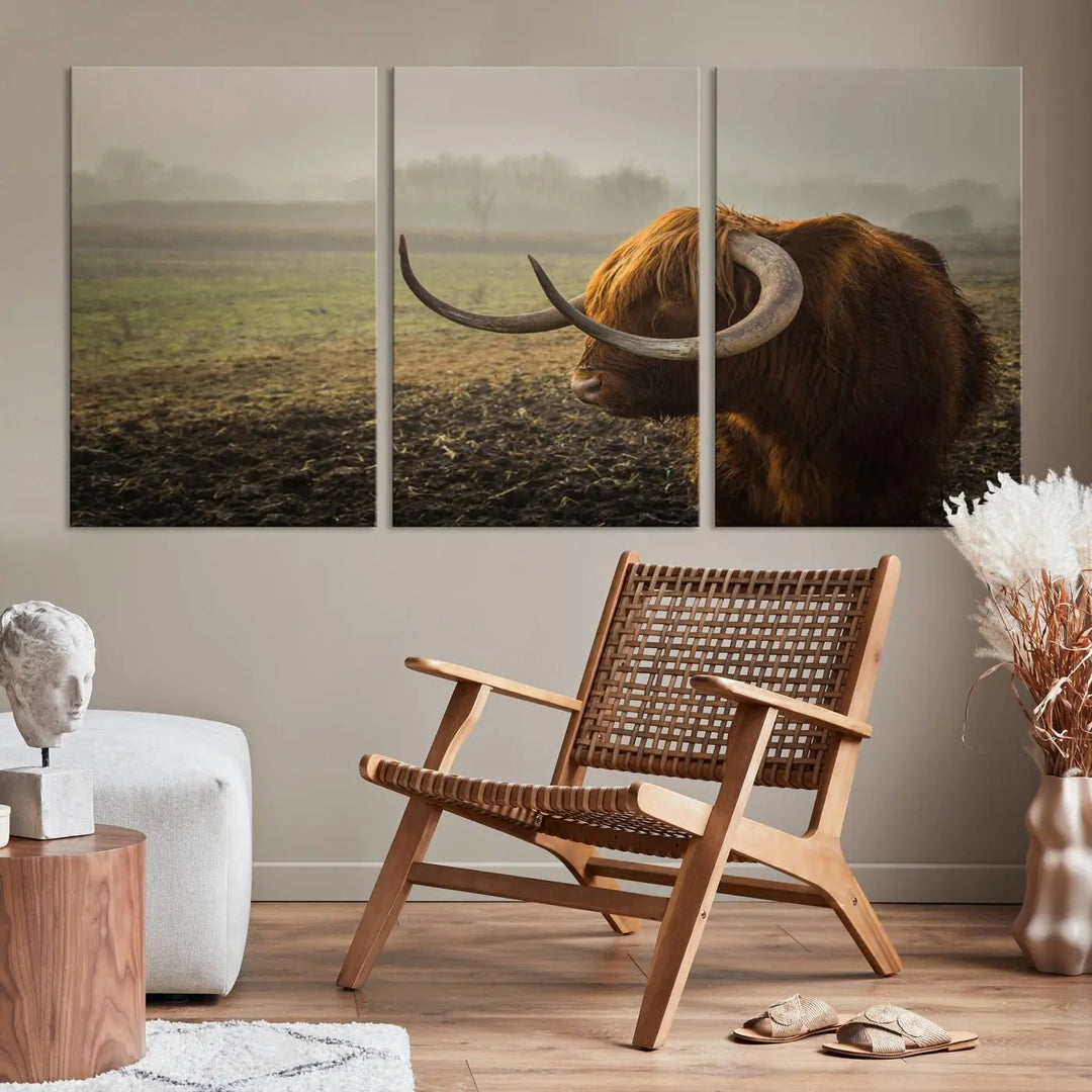 The "Big Cow Horn Wall Art Canvas Print" is a hand-assembled framed canvas depicting a Highland cow in a misty field. It is crafted with a UV-protective coating to ensure lasting vibrancy.