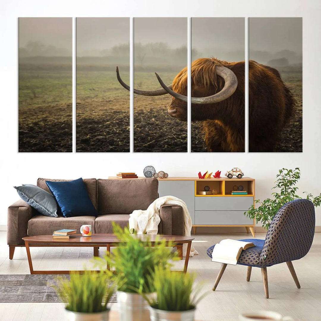 The "Big Cow Horn Wall Art Canvas Print" is a hand-assembled framed canvas depicting a Highland cow in a misty field. It is crafted with a UV-protective coating to ensure lasting vibrancy.